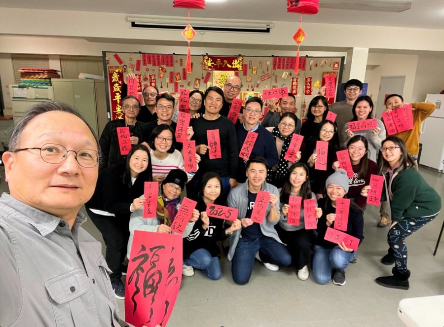 Joseph Fellowship members writing Chinese New Year blessing banners